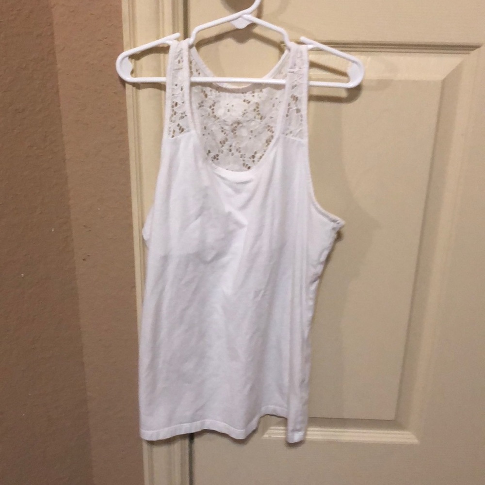 A Tank top with flowers at the top of the shirt